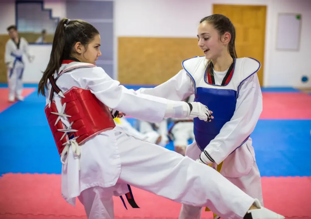 Sports activities for teenagers - Girls practicing martial arts.