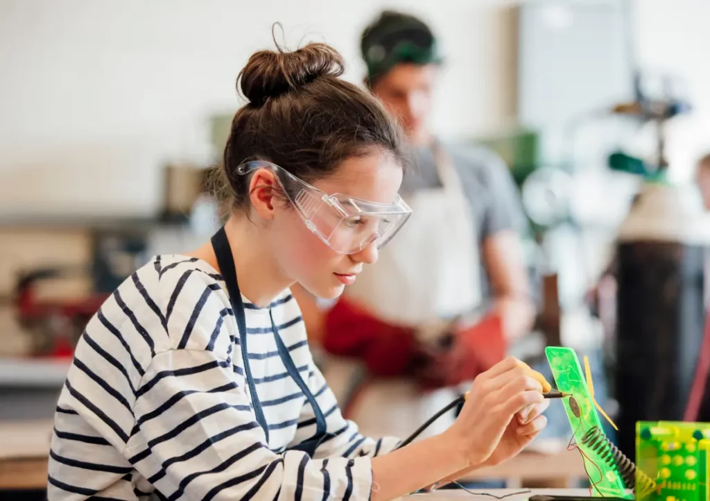 Technological extracurriculars - Girl building robot.