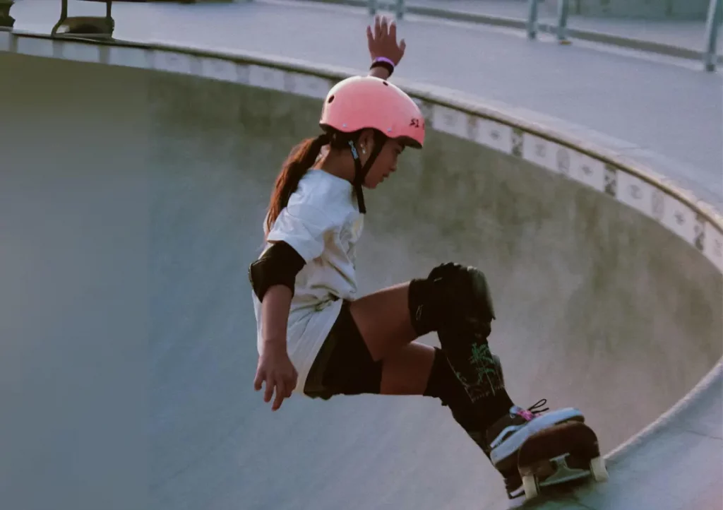 Girl practicing skateboarding