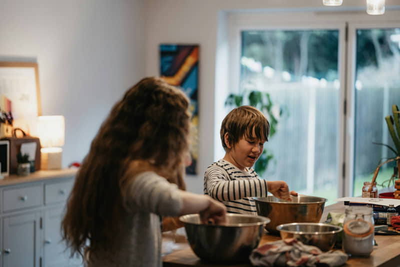 Family cooking.
Two children cooking at home. 